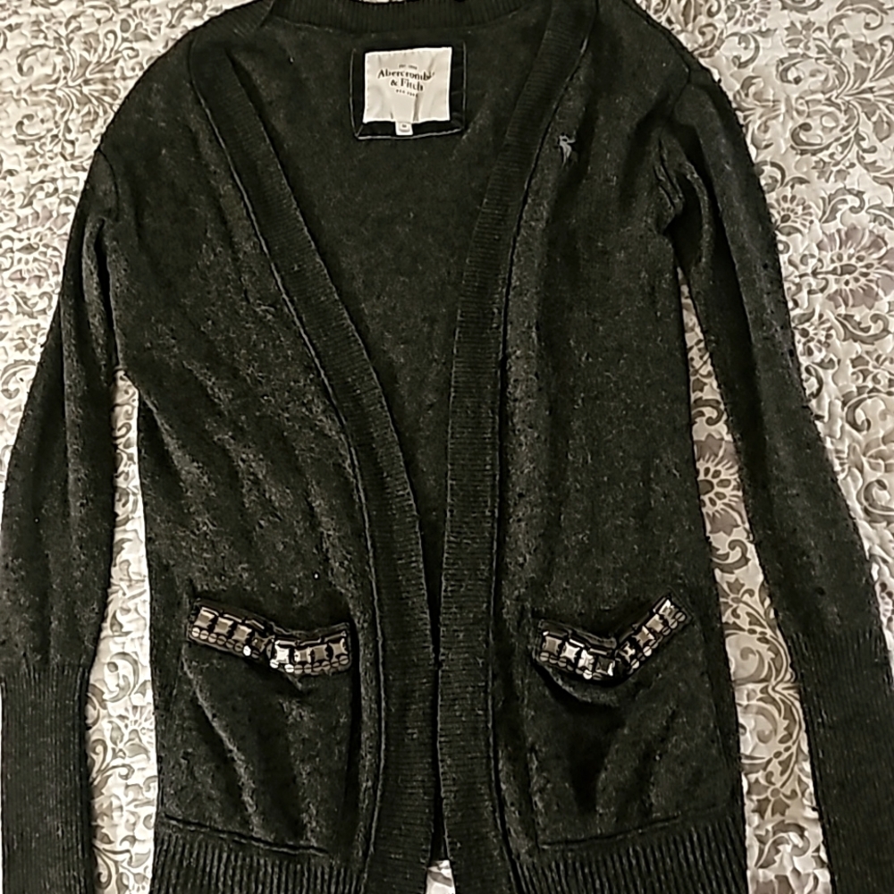 Dark gray cardigan with pockets.